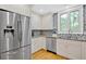 Kitchen featuring stainless steel appliances, granite countertops, and a tiled backsplash at 4144 D Youville Trce, Atlanta, GA 30341