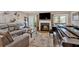 A modern living room with an entertainment center, fireplace and patio door for easy outdoor access at 4144 D Youville Trce, Atlanta, GA 30341