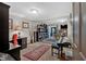 Recreation room featuring built-in bookshelves, desk area, and walk-out to porch at 4144 D Youville Trce, Atlanta, GA 30341