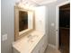 Bathroom featuring decorative mirror, modern vanity, and updated lighting at 711 Cypress Pointe St, Johns Creek, GA 30022