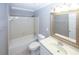 Bathroom featuring vanity, toilet and tub-shower combo with tiled walls at 711 Cypress Pointe St, Johns Creek, GA 30022