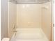 Clean, well-maintained bathtub and shower with tiled walls and modern fixtures at 711 Cypress Pointe St, Johns Creek, GA 30022