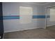 Bedroom with light blue accent wall and blue stripes and mirror door closet at 711 Cypress Pointe St, Johns Creek, GA 30022