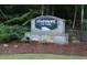 Stone sign for Rivermont The Park community welcomes residents and visitors with landscaping at 711 Cypress Pointe St, Johns Creek, GA 30022