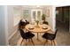Inviting dining area with a round table, seating for four, and natural light at 711 Cypress Pointe St, Johns Creek, GA 30022