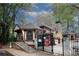 Gated community house with stone accents and beautiful landscaping at 711 Cypress Pointe St, Johns Creek, GA 30022