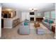 Spacious living room with a fireplace, a ceiling fan and comfortable seating at 711 Cypress Pointe St, Johns Creek, GA 30022