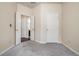 Bedroom featuring fresh paint, plush carpet, and a white closet door at 750 Beckenham Walk Dr, Dacula, GA 30019
