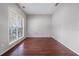 This bedroom has hardwood floors, natural light, and offers a serene atmosphere at 750 Beckenham Walk Dr, Dacula, GA 30019