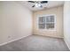 Bright bedroom featuring natural lighting, carpet, and neutral paint at 750 Beckenham Walk Dr, Dacula, GA 30019