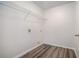 Walk-in closet featuring laminate flooring and wire shelving system at 750 Beckenham Walk Dr, Dacula, GA 30019