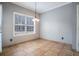 A clean dining room with neutral paint, natural lighting, and tile floors at 750 Beckenham Walk Dr, Dacula, GA 30019