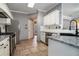 Charming kitchen with stainless steel appliances, granite counters, and tile floors at 750 Beckenham Walk Dr, Dacula, GA 30019