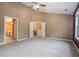 Spacious main bedroom with a ceiling fan and access to a bathroom at 750 Beckenham Walk Dr, Dacula, GA 30019