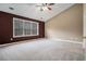 Spacious main bedroom with a ceiling fan, natural lighting, and carpet at 750 Beckenham Walk Dr, Dacula, GA 30019