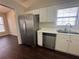 Kitchen featuring a stainless steel refrigerator and dishwasher and view of the backyard at 275 Circle Rd, Dacula, GA 30019