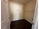 Laundry room featuring dark laminate floors and a wire shelf for storage at 275 Circle Rd, Dacula, GA 30019