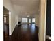 Spacious living room with hardwood floors, a fireplace, and large windows providing natural light at 275 Circle Rd, Dacula, GA 30019