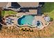 Bird's-eye view of a backyard boasting a pool, hot tub, patio, and fire pit, with lush landscaping and a well-maintained lawn at 330 Peninsula Pt, Canton, GA 30115