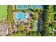 Overhead shot of the community pool with lounge chairs, a playground, and a basketball court at 330 Peninsula Pt, Canton, GA 30115