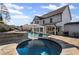 Enjoy the in-ground pool, hot tub, and patio in this beautifully landscaped backyard at 330 Peninsula Pt, Canton, GA 30115