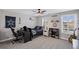 This cozy bedroom is complete with a ceiling fan, a large window for natural light, and sports decor at 330 Peninsula Pt, Canton, GA 30115