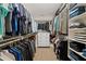 A large walk-in closet features built-in shelving, drawers, and ample hanging space at 330 Peninsula Pt, Canton, GA 30115