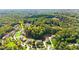 Aerial shot of 330 Peninsula Point showcasing lush greenery, community pocket parks, and mature trees at 330 Peninsula Pt, Canton, GA 30115