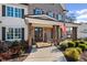 Inviting front porch of a brick home with wood columns and a welcoming welcome sign at 330 Peninsula Pt, Canton, GA 30115