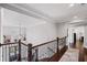 View of the beautiful entry hallway with hardwood floors, iron railing and an open floor plan at 330 Peninsula Pt, Canton, GA 30115