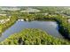 Scenic aerial view of a lake, with the community park and amenities visible along the shoreline at 330 Peninsula Pt, Canton, GA 30115