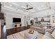 Open concept living room featuring a view to the kitchen and dining area, hardwood floors, and neutral decor at 330 Peninsula Pt, Canton, GA 30115