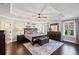 Spacious main bedroom featuring tray ceilings, hardwood floors, and an abundance of natural light at 330 Peninsula Pt, Canton, GA 30115