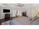 A view of the expansive main bedroom with tray ceiling and neutral walls at 330 Peninsula Pt, Canton, GA 30115