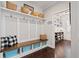 This mudroom features custom cabinets, shelving, and hardwood flooring at 330 Peninsula Pt, Canton, GA 30115
