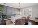 Charming home office featuring grey paneled accent wall, neutral decor, large window with wood shutters and hardwood floors at 330 Peninsula Pt, Canton, GA 30115