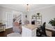 Bright home office with French doors, neutral decor, hardwood floors, and ample natural light creates a workspace at 330 Peninsula Pt, Canton, GA 30115