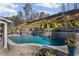 In-ground pool with water feature and landscaped backyard at 330 Peninsula Pt, Canton, GA 30115