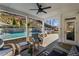 Covered outdoor patio and seating area with a view of the pool and yard at 330 Peninsula Pt, Canton, GA 30115