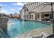 Large in-ground pool with waterfall feature and comfortable seating at 330 Peninsula Pt, Canton, GA 30115