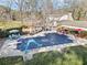 The home's outdoor pool area is perfect for summer fun; it includes a pool house, gazebo, and lounge area at 444 Pineview Dr, Canton, GA 30114