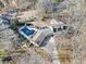 Aerial view of house with long driveway, pool, and outdoor furniture on a large lot at 444 Pineview Dr, Canton, GA 30114