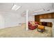 Finished basement featuring built-in shelving, a desk area, and a cozy seating area with natural light at 444 Pineview Dr, Canton, GA 30114