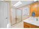 Bathroom showcasing a glass shower and vanity with natural light at 444 Pineview Dr, Canton, GA 30114