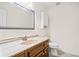 Cozy bathroom featuring vanity sink, toilet, and medicine cabinet for ample storage at 444 Pineview Dr, Canton, GA 30114