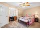 Charming bedroom with decorative bedding, desk, and natural light at 444 Pineview Dr, Canton, GA 30114