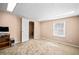 Well-lit bedroom with neutral carpet and a view from the large window at 444 Pineview Dr, Canton, GA 30114