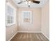 Neutral bedroom with a ceiling fan and window allowing natural light at 444 Pineview Dr, Canton, GA 30114