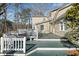 Decking area with table and chairs for enjoying the outdoors, with home's siding visible at 444 Pineview Dr, Canton, GA 30114