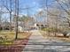 Spacious home with a long driveway, three-car garage, and lush surroundings at 444 Pineview Dr, Canton, GA 30114